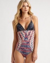 An intriguing swimsuit with an idyllic combination of contrasting prints and a head-turning neckline. Plunging necklineSelf ties at backRayon/polyesterHand washMade in Italy of imported fabric