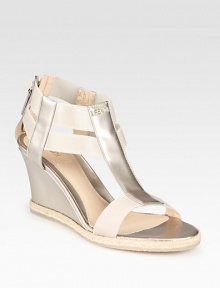 A demi-wedge lifts this t-strap silhouette rendered in opalescent leather with textured rope edging. Self-covered wedge, 2¾ (70mm)Pearlized patent leather upper with elastic straps and espadrille trimBack zipLeather lining and solePadded insoleMade in Italy