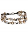 Golden and silvery tones add style to this retro beaded bracelet from Lucky Brand. Crafted in silver tone and gold tone mixed metal with a leather cord. Approximate length: 7-5/8 inches.