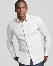 With subtle light gray stripes and a body-hugging slim fit, this button down sport shirt from Theory is a stylish must-have.