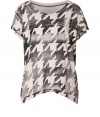 Channel of-the-moment style in this super soft graphic print tee from cult denim label Current/Elliott - Round neck, short sleeves, asymmetric hem, allover print - Relaxed silhouette - Style with favorite skinnies and edgy ankle boots