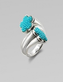 A graduated sterling silver shank with turquoise accented, flower-shaped end caps. TurquoiseSterling silverWidth, about 1Imported