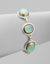 From the Gauntlet Collection. Smooth linked ovals of pastel aqua chalcedony, elegantly framed in granulated sterling silver and hammered 24k gold.Aqua chalcedonySterling silver and 24k yellow goldLength, about 7½Imported