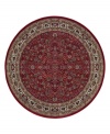 Inspired by the lovely Sarouk carpets of ancient Persia, this round rug features an intricate floral motif in ivory, sage green and accents of soft blue against a rich red ground.