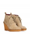 Finish daytime looks on a Downtown-cool note with Marc by Marc Jacobs sand suede lace-up booties, detailed with crepe wedges for a that modern-classic feel - Rounded toe, stitched welt, rounded cotton laces, logo aglets, natural crepe sole unit - Perfect for adding a cool edge to contemporary knits and printed pants