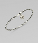 From the Cable Collectibles Collection. Signature sterling silver cable band is adorned with a delicate diamond heart lock for a memorable keepsake.Diamond, 0.14 tcw Sterling silver Width, about 3mm Hook closure Imported 