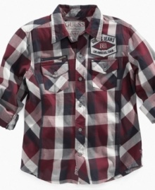 Front pockets on this plaid shirt from Guess offer a touch of style that makes it easy to wear whether his style is preppy or relaxed.