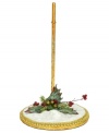 Put your Mark Roberts figurine on a pedestal of shimming snow and gold. A bit of Christmas foliage adds to the festive display.