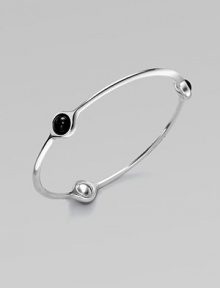 A sleek and modern piece with three smooth black agate stations set in sterling silver. Black agateSterling silverSlip-on styleLength, about 7¾Imported 