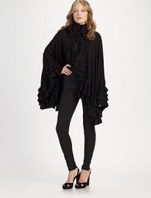 Exquisitely crafted merino wool with cascading ruffles, poncho sleeves and a flowing, feminine silhouette. Tiered ruffle collarHook-and-eye closures at collarRuffled open frontLong poncho sleevesTiered ruffle hemMerino woolDry cleanImported