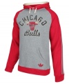 Keep warm as you cheer and rant for the Chicago Bulls in this pullover hoodie by adidas.