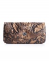 A slim clutch in a snakeskin print livens up nighttime looks or adds a ultra chic note for day, by Style&co.