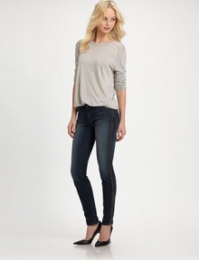 Dark-wash skinnies styled with contrasting leather trim and slight fading. THE FITSkinny fitRise, about 8½Inseam, about 30THE DETAILSButton closureZip flyFour-pocket styleFully linedBody: 92% cotton/7% polyester/1% spandex; Contrast: LeatherDry cleanMade in USAModel shown is 5'10 (177cm) wearing US size 24.