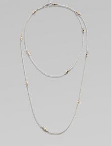 A long-enough-to-double sterling silver chain, delicately spaced with clusters of tiny, faceted 14k gold beads.14k yellow gold and sterling silverLength, about 40Spring ring claspMade in USA