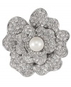 Floral fixation. A pretty pansy adorns this beautiful brooch from Carolee. Crafted in silver tone mixed metal, it's adorned with glittering glass accents as well as simulated pearls. Approximate diameter: 1-3/4 inches.