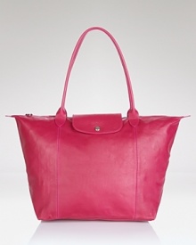 A bright alternative to black, Longchamp's fuchsia leather tote lends color-pop luxe to your purse portfolio. The smooth bag is prime to carry must-haves on the town or during weekend getaways.