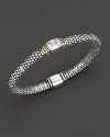 From the Glacier collection, thin caviar rope bracelet with centered white topaz stone and gold accents. Designed by Lagos.