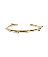 Stylish cuff bracelet made ​.​.of fine, gold-colored brass - Narrow with cool thorn-like spikes - Casual punk attitude rocks every simple outfit - Pair with your favorite tee and jeans or with a simple daytime dress - Wear solo or stacked with multiple bangles