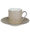 Enjoy a bold brew with this enormously stylish espresso cup and saucer set. From innovative designer Monique Lhullier, it features a pearlescent soft tan border with glossy raised dots and a fine stitch-like pattern.