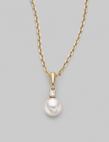 Simple and lovely, a white, round cultured Akoya pearl has a sparkling diamond accent, plus a chain and setting of 18k gold. 6mm white round cultured pearl Quality: A+ Diamond, 0.03 tcw 18k yellow gold Length, about 18 Spring ring clasp Imported