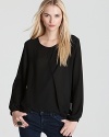 Draped details lend a low-key look to Sweet Pea's long sleeved top, classic in black.