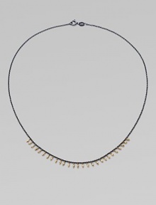 A delicate design with 14k gold beads on oxidized sterling silver chain. 14k gold beadsOxidized sterling silverLength, about 16Spring ring closureMade in USA 