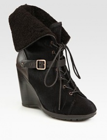 Dyed calf hair and leather wedge with a lace-up front, buckle detail and fold-over shearling cuff. Stacked wedge, 4 (100mm)Covered platform, ½ (15mm)Compares to a 3½ heel (90mm)Dyed calf hair and leather upperShearling liningRubber solePadded insoleMade in Italy