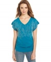 Tiny, pearl-like beads stream down the bodice of this tee from Curious Gypsy, creating fun design on a closet staple!