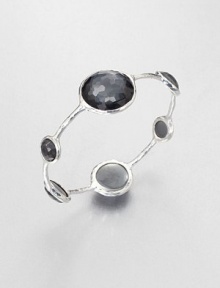 From the Wonderland Collection. Round faceted hematite doublet stations in various sizes set on a hammered sterling silver bangle. Hematite doubletSterling silverDiameter, about 2.5Slip-on styleImported 