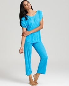 Lounge around in style with a short gathered sleeve top and wide leg capri pants.