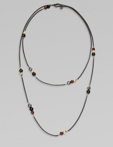 From the Black and Gold Chain Collection. A dramatically, long blackened sterling silver box chain with 18k gold, black onyx, hematite and garnet bead stations in various sizes; perfect for wearing doubled. Blackened sterling silver18k gold, black onyx, hematite and garnet beadsLength, about 40Lobster clasp closureImported 