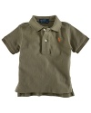 Rendered in lightweight, breathable cotton mesh, this classic polo features a requisite embroidered pony at the chest.