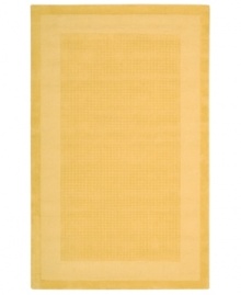 In sunny yellow, this bright rug adds some cheer to every space. A distinctive center grid gives the rug a delightful texture while coordinating well with both traditional and modern interiors. Hand-tufted of wool for premium softness and durability.