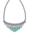 Infuse your look with a pastel palette of color. Bar III's stunning statement necklace features a pyramid designdecorated with ribbons in gray, ivory, and pastel green hues. Set in silver tone mixed metal. Approximate length: 24 inches. Approximate drop length: 2 inches. Approximate drop width: 6-1/2 inches.