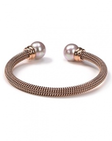 Majorica's rose gold bangle exudes cool confidence. Solo or stacked, wear yours at cocktail hour to give night time looks a strong spin.