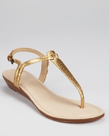 Genuine snakeskin shimmers in bronze on these gilded DKNY sandals.