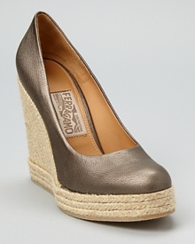 Mercury-hued metallic leather lends shimmer and shine to the Bernie espadrille wedges from Salvatore Ferragamo.