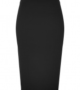 The classic pencil skirt gets a modern update with this luxe version from Donna Karan - Figure-hugging fit, back concealed zip closure and slit  - Style with a blouse, a draped front leather jacket, and platform heels