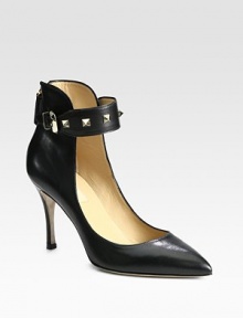 Head-turning leather silhouette with a classic point toe, adjustable ankle strap and gleaming metal studs. Self-covered heel, 3½ (90mm)Leather upper with metal studs on adjustable buckle strapPoint toeBack zipLeather lining and solePadded insoleMade in ItalyOUR FIT MODEL RECOMMENDS ordering true size. 