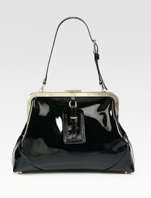 Lush patent leather in a gorgeous frame-top silhouette for lady-like chic.Adjustable shoulder strap, 9¾-11 dropTop clasp closureProtective metal feetOne inside zip pocketTwo inside open pocketsCotton lining15¼W X 10H X 3½DImported