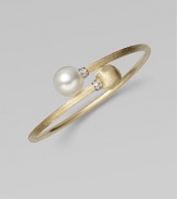 Brushed 18k yellow gold, luminous diamonds, and an iridescent pearl richly combine to create this artistic, elegant design.Diamonds, 0.06 tcw Freshwater pearl 18k yellow gold Diameter, about 2½ Made in Italy