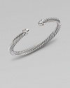 From the Color Classic Collection. A signature Yurman cable of sterling silver, richly enhanced by bands of pavé diamonds, encircling the end caps. Diamonds, 0.09 tcw Sterling silver Cable, 5mm Diameter, about 2½ Made in USA