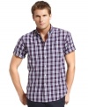 Prep for a good day with the bold statement of plaid in this shirt from Izod.