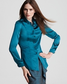 Impossibly soft silk takes on a dark peacock hue on this jewel-toned Burberry blouse. Adopt a monochromatic look with a matching skirt.