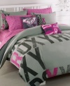 Hop on board with this bold and ultra-modern Express duvet cover set. Features black and pink oversized Roxy lettering in different patterns on a grey background.