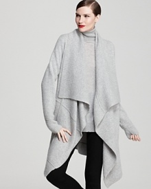 This flowing Donna Karan New York cashmere sweater is an elegant hybrid with the luxe knit of a well-loved cardigan and a flowing silhouette of an open overcoat.