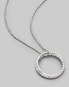 From the Silver Ice Crossover Collection. Two intertwining rings, one of sterling silver cable, the other of white gold set with pavé diamonds, hanging elegantly from a sterling silver box chain. Diamonds, 0.39 tcw Chain length, about 16 Pendant diameter, about 1 Lobster clasp Made in USA