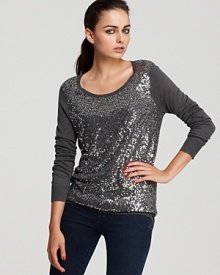 Drenched in dazzling sequins, this subtly striped sweater adds true sizzle to your style for a high-voltage holiday. Amp up downtown denim or lend thrill to a sleek skirt--either way this shimmer is the shining star of your look.