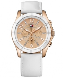 Refined excellence with a regal touch, by Tommy Hilfiger. Watch crafted of white leather strap and round rose-gold plated stainless steel case with white enamel bezel. Rose-gold tone textured chronograph dial features triple-crystal accent markers, rose-gold tone numerals, three subdials, rose-gold tone three hands and iconic flag logo at twelve o'clock. Quartz movement. Water resistant to 30 meters. Ten-year limited warranty.