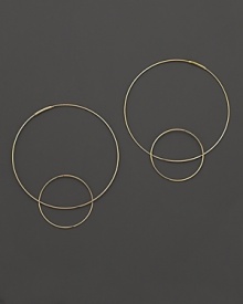 Like magic, smaller hoops balance on 14K gold counterparts.